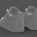 Pair of White Leather Low Top Sneakers With Lace Up Design And Comfortable Sole