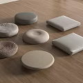 Various Shaped Floor Cushions With Neutral Textures On Wooden Floor