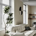 White Sectional Sofa In Living Room With Black Pillow Green Plant Clock And Window Blinds