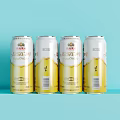 Neatly Arranged Yanjing Beer Four Beer Cans On Light Blue Background