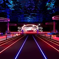 Modern Bar With Deep Blue Purple Lighting Starry Cosmic Ceiling Circular Neon Decorations And Seating