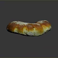 Freshly Baked C Shaped Sweet Bread With Golden Brown Crust And Powdered Sugar