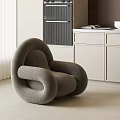 Modern Gray Curved Lounge Chair In Interior With White Blinds And Cabinets