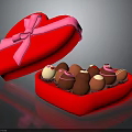 Open Red Heart Shaped Box With Pink Ribbon Bow And Assorted Chocolates