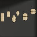 Various Style Pendant Lights With Fabric Shades And Black Metal Frames On Dark Wall