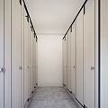 Public Toilet With Light Colored Stalls Black Frames And Modern Clean Design