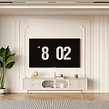 Modern White TV Stand With TV Decorative Items And Green Plant In Living Room