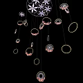 Stylish Decorative Hanging Ornament With Circular Rings And Floral Patterns On Black Background
