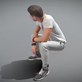 Man Sitting In Gray Sweatpants White T-Shirt Wearing Watch Holding Thermal Cup On Gray Background