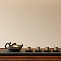 Minimalist Traditional Tea Set With Black Teapot And Four Teacups On Wooden Tray