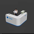 White And Blue Reception Desk With MAX Logo And Female Staff Near Flower Arrangement