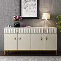 Elegant White Console Cabinet With Gold Handles Legs Vase Lamp And Decorative Painting