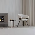 Modern White Leisure Chair With Black Wooden Legs In Living Room With Fireplace And Curtains