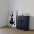 Modern Living Room With Dark Blue Cabinet Wooden Top White Vases And Abstract Painting