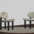 Two Woven Leisure Chairs with Dark Legs on Round Rug and White Blinds Interior