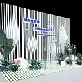 Photo Spot With Black White Striped Backdrop Blue Text Green Plants White Stones And Flowers