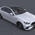 White Mercedes AMG Sedan With Sporty Front Grille And Black Alloy Wheels