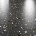 Black Marble Component with Sphere Base against Dark Columns and Circular Material Samples