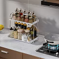 Organized Spice Bottles On White Rack For Modern Kitchen Counter With Gas Stove