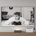 Wall Mounted TV Displaying Classic Black And White Portrait With Wooden Stand And Devices