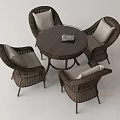Wicker Table and Chair Set with Round Wooden Top and Light Colored Cushions