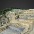 Open Pit Mine Terrain With Terraced Excavated Layers And Green Vegetation
