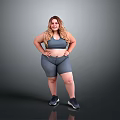 Woman in Gray Sports Bra and Gray Shorts with Hands on Hips Wearing Black Sneakers