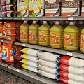 Retail Display Shelves Stocked With Various Snacks Drinks And Packaged Goods In Modern Store