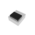Black Integrated Circuit Chip Mounted On Gray Base With Metal Pins