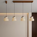 Minimalist Pendant Lights with White Shades and Wooden Bases Hanging in Modern Interior Setting