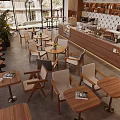 Cozy Modern Cafe Interior With Wooden Tables Chairs Green Plants Coffee Bar