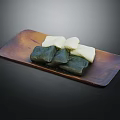 Traditional Green And White Dessert Pastries Arranged On Wooden Serving Plate