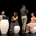 Group of People Sitting Standing on White Spherical Seats with Laptop and Casual Outfits