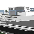 Campus Area With Connected Buildings Surrounding Trees Lawns Parking And Roadways