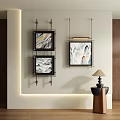 Abstract Paintings Framed Artwork Hanging on Wall in Modern Interior with Lamp and Wooden Table