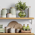 Elegant Kitchenware Display On Shelves With Bowls Jars Bottles And Green Plants Against Brick Wall