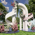 Outdoor Heart Shaped Arch With Pink White Flowers Ribbon And Floral Decorations On Grassy Lawn