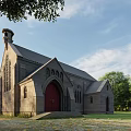 Gray Stone Church Exterior With Red Door Steeple Tower Surrounding Trees And Blue Sky Clouds
