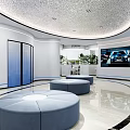 Modern Bank Lobby Interior With Round Blue Sofas Digital Screens And Marble Flooring