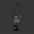 Green Industrial Device With Black Handle And Yellow Information Label