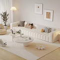 Beige Sofa And Coffee Table Set With Multiple Pillows Rug Floor Lamp And Decorative Paintings