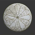 White Circular Decorative Sculpture Carving With Intricate Floral Patterns And Textures