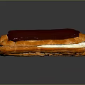 Golden Pastry Éclair With Rich Chocolate Glaze And Cream Filling