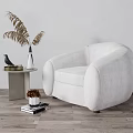 White Curved Upholstered Single Sofa With Side Table Vase Plant On Wooden Floor Gray Wall