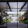 Modern Commercial Landscape Design With Glass Doors Louvered Roof Courtyard Stone Pathway And Lush Greenery
