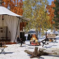 Scenic Campsite With White Tent Autumn Trees Tables Chairs And Sandy Ground