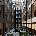 Spacious Multi Story Atrium Interior With Ceiling Art Water Pond And Green Plants