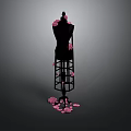 Black Mannequin Decorated With Pink Petals Standing In Dark Background