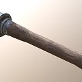 Ancient Weapon with Worn Metal Head and Textured Wooden Handle