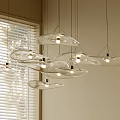 Modern Minimalist Disc Shaped Transparent Glass Pendant Lights Near Window With Blinds And Soft Lighting